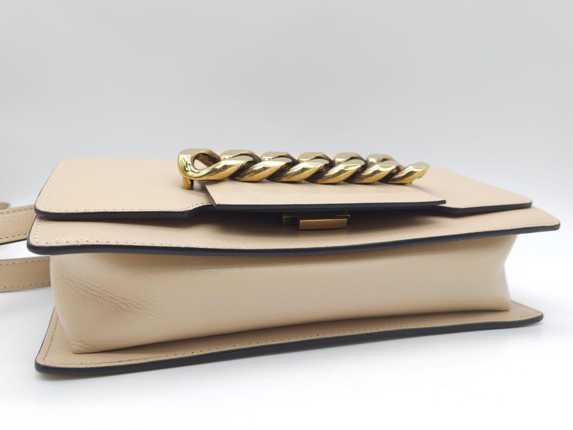 A Givenchy Nude Infinity Crossbody Bag. Leather exterior with front flap, gold toned hardware, - Bild 11 aus 12