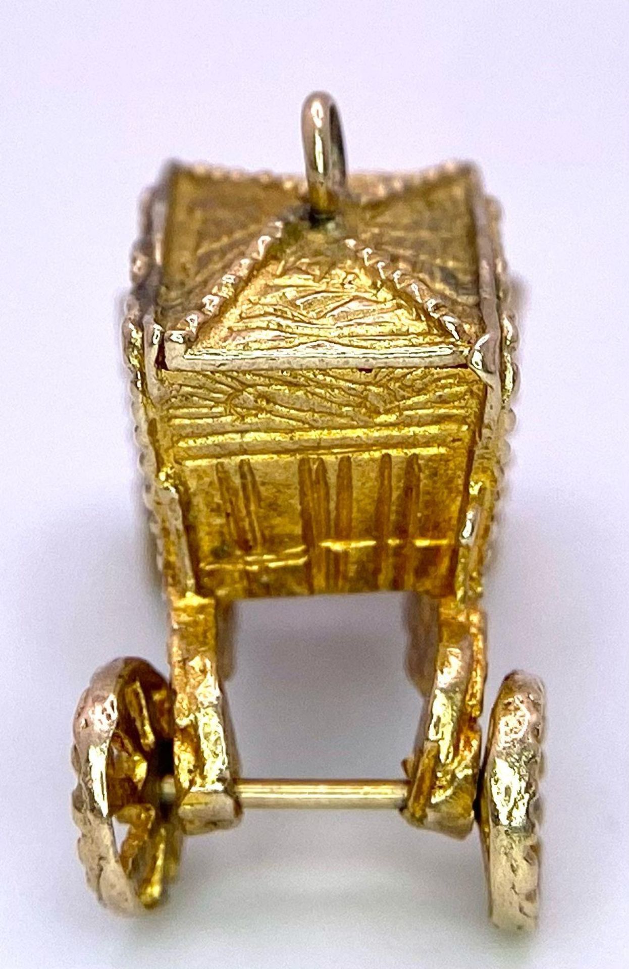 A 9K Yellow Gold Royal Carriage Charm with Moving Wheels. Approximately 24mm wide, 4.2g weight. - Image 2 of 4