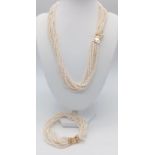 An Eight Row Cultured Seed Pearl Necklace and Bracelet Set. Both with gilded clasps. Necklace - 48cm