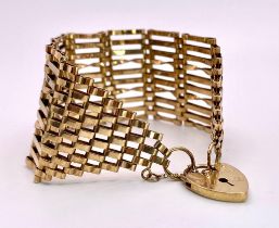 A Vintage 9K Yellow Gold Wide Gate Bracelet with Heart Clasp. 17cm. 34mm wide. 21.2g weight.