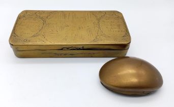 A pair of antique 19th century brass smoking related items consisting of a Dutch engraved tobacco