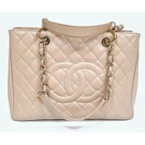 Chanel Grand Shopping Tote Bag. Comes in a classic cream, diamond stitched and CC logo design.