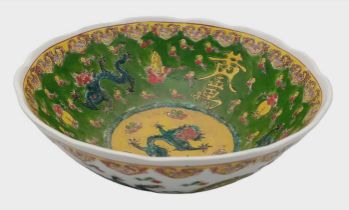 A colourful antique Chinese Fruit Bowl. Marked on the bottom, this gorgeous depicts flying