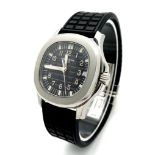 A Patek Phillippe Aquanaut Watch. Textured black rubber strap. Stainless steel case - 36mm.