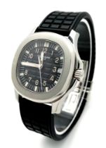 A Patek Phillippe Aquanaut Watch. Textured black rubber strap. Stainless steel case - 36mm.