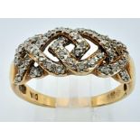 9K YELLOW GOLD, DIAMOND FANCY ENTANGLED RING. 0.40CTW. WEIGHS 3.4G AND SIZE T. REF: SC 7066