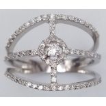 An 18K White Gold and Diamond Cross Ring. Central round cut diamond in a cross setting. Size N. 3.