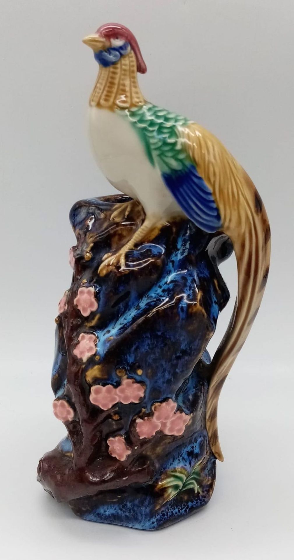 A stunning antique Chinese Terracotta Figure with a perched bird. Wonderful colours throughout. Seal
