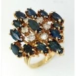 An 18K Yellow Gold (tested) Diamond and Sapphire Dress Ring. Six brilliant round cut diamonds - 0.