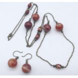 Suite of Banded Agate Jewellery. 1) Beaded Long Necklace, measuring 96cm in length 2) Bead Earrings,