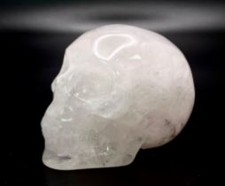 A Rose Quartz Hand Carved Skull Figure. Small paperweight or curiosity. 5cm x 4cm.