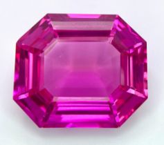 An amazing, large (41,1 carats), emerald cut, pink RUBY with very interesting optical properties due