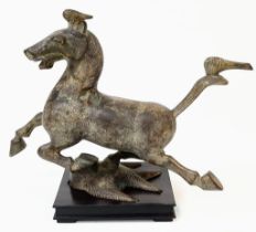 A Chinese Bronze Sculpture of the 'Flying Horse of Gansu'. The original sculpture was created in