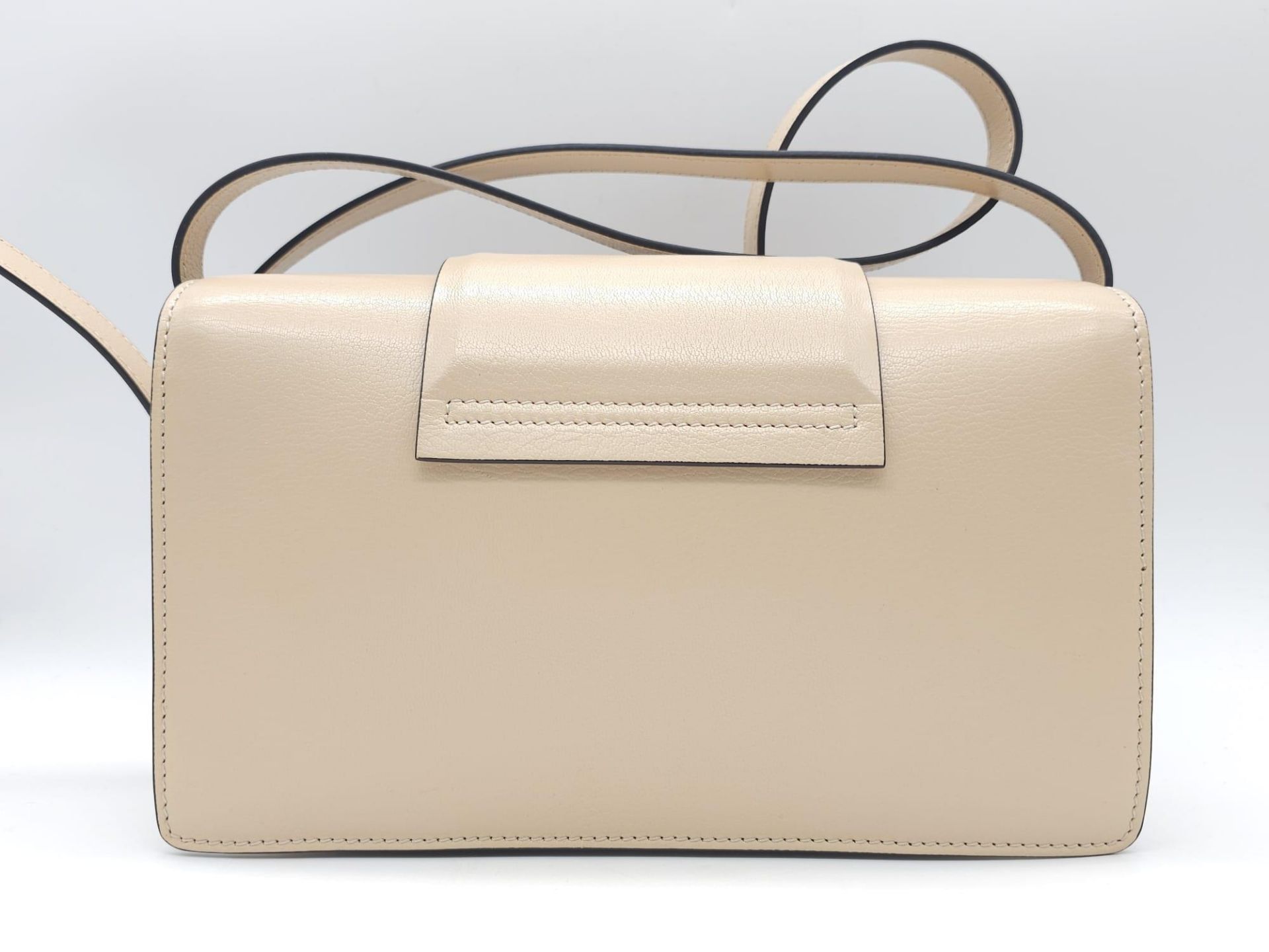 A Givenchy Nude Infinity Crossbody Bag. Leather exterior with front flap, gold toned hardware, - Bild 5 aus 12