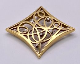 A Decorative Celtic 18K Yellow Gold and Diamond Pendant. 3.5cm x 3.5cm. 7.48g total weight.