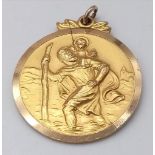 A Vintage 9K Yellow Gold Circular St. Christopher Pendant. 21mm diameter. 5g weight. Small crack