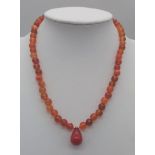 Beaded Orange Stone Necklace, Red Stone Pendant. 38cm in length.