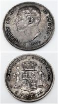 A Silver 1876 Spanish Alfonso XII 5 Pesetas Coin.