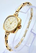 A Vintage 9K Gold Hirco Ladies Watch. 9K gold expandable spring bracelet. 9k gold case - 21mm. White