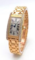 An 18K Gold and Diamond Cartier Tank Americaine Ladies Watch. 18K gold bracelet and case - 19mm