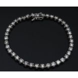 A 5ct Diamond 900 Platinum Tennis Bracelet. 38 brilliant round cut diamonds of a high grade create a
