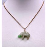 A Jade Hippopotamus Pendant on a 9K Yellow Gold Necklace. 2cm pendant. 42cm necklace. 8.53g total