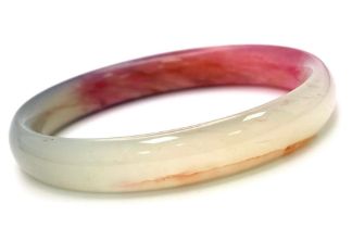 Beautiful Multi-Coloured Jade Bangle. Measures 7cm in diameter. Comes in box.