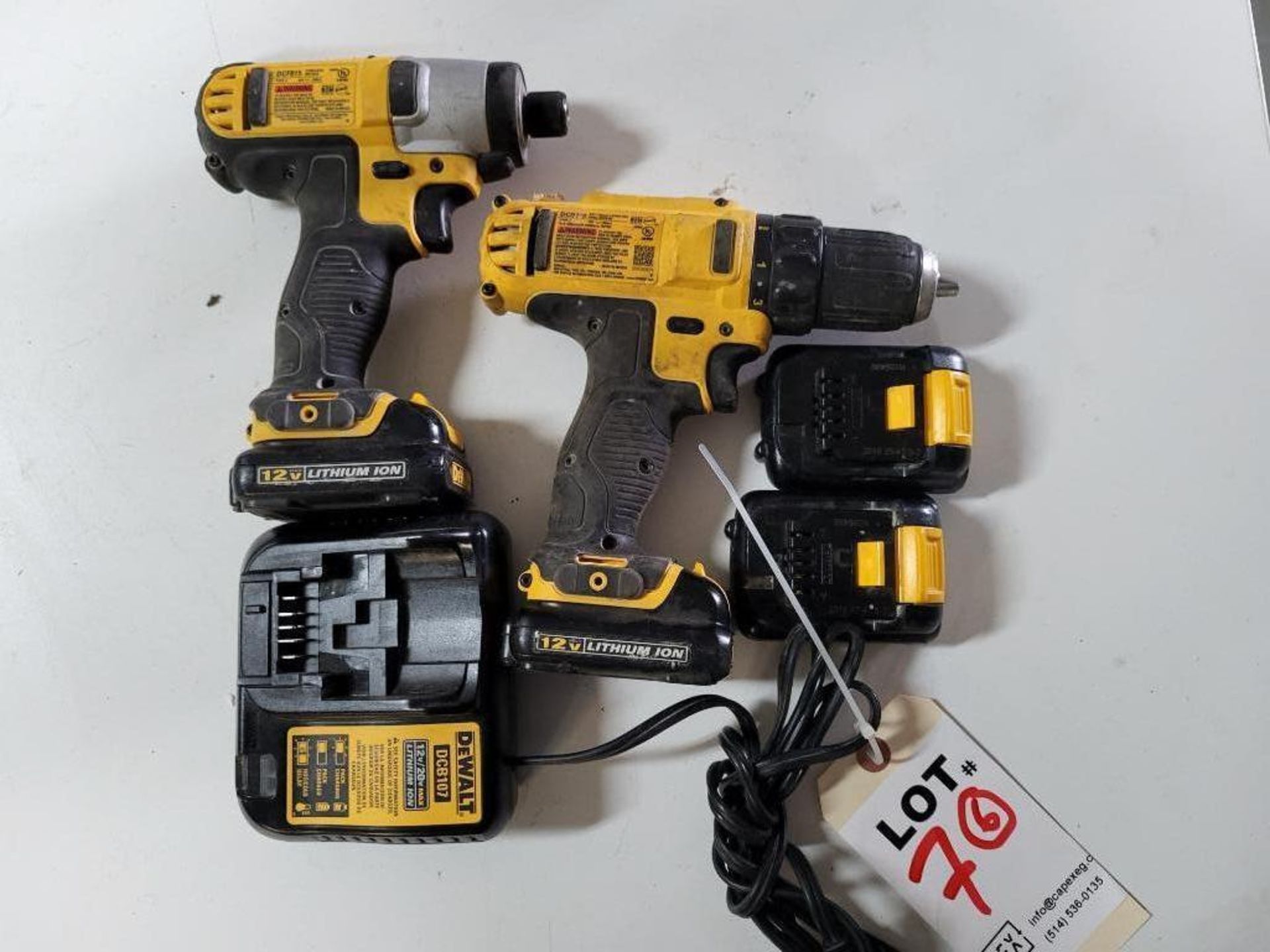 Lot Of DeWalt 12 Volt Battery Tools Consisting Of 1 Drill 1 Impact Drill 4 Batteries 1 Charger