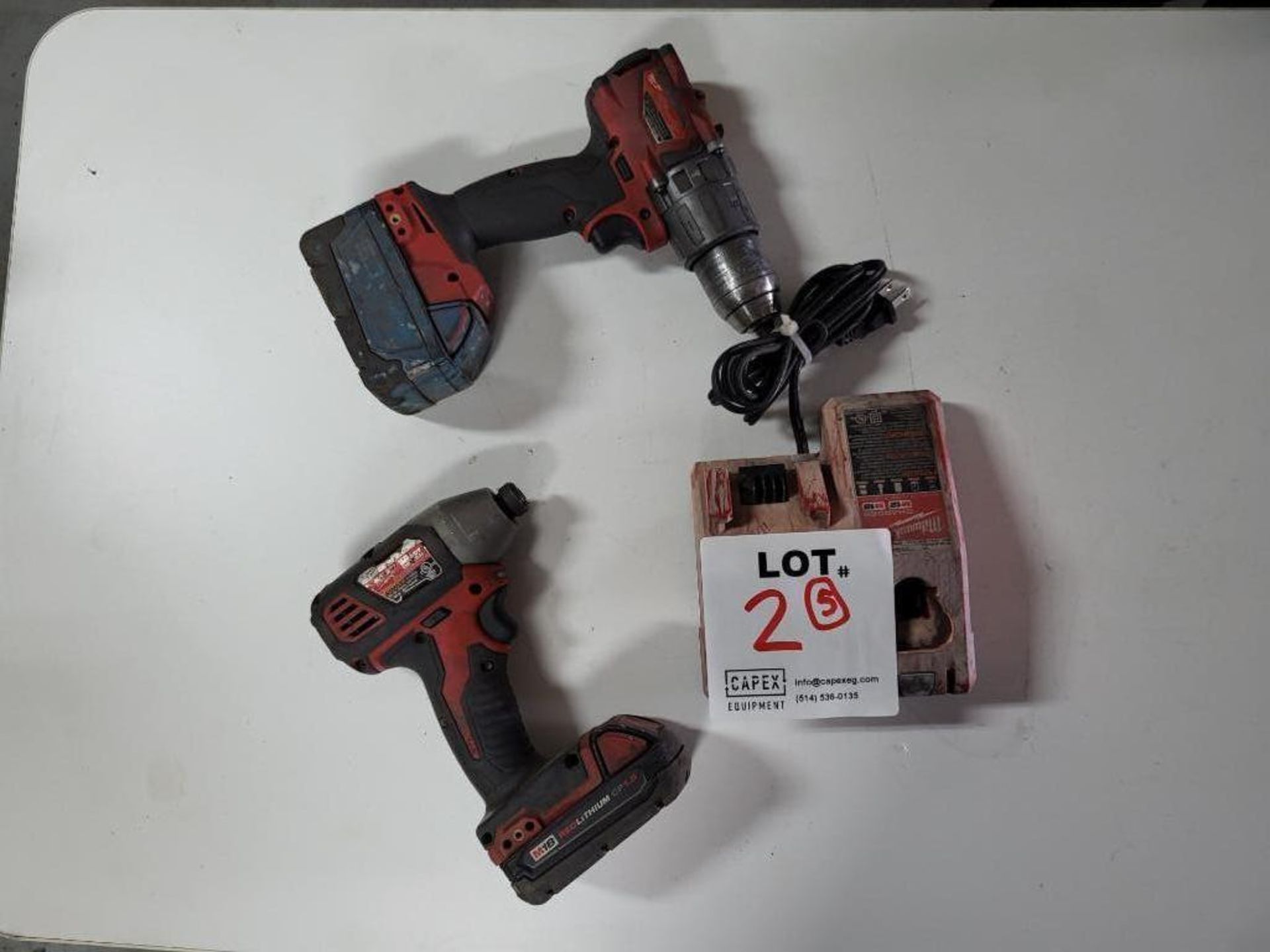 Lot Of Milwaukee Fuel Battery Tools Consisting Of 1 Drill 1 Impact Drill 2 Batteries 1 Charger