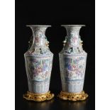 Arte Cinese A pair of cantonese famille rose vases with qilong moulded handlesChina, Qing, early 20