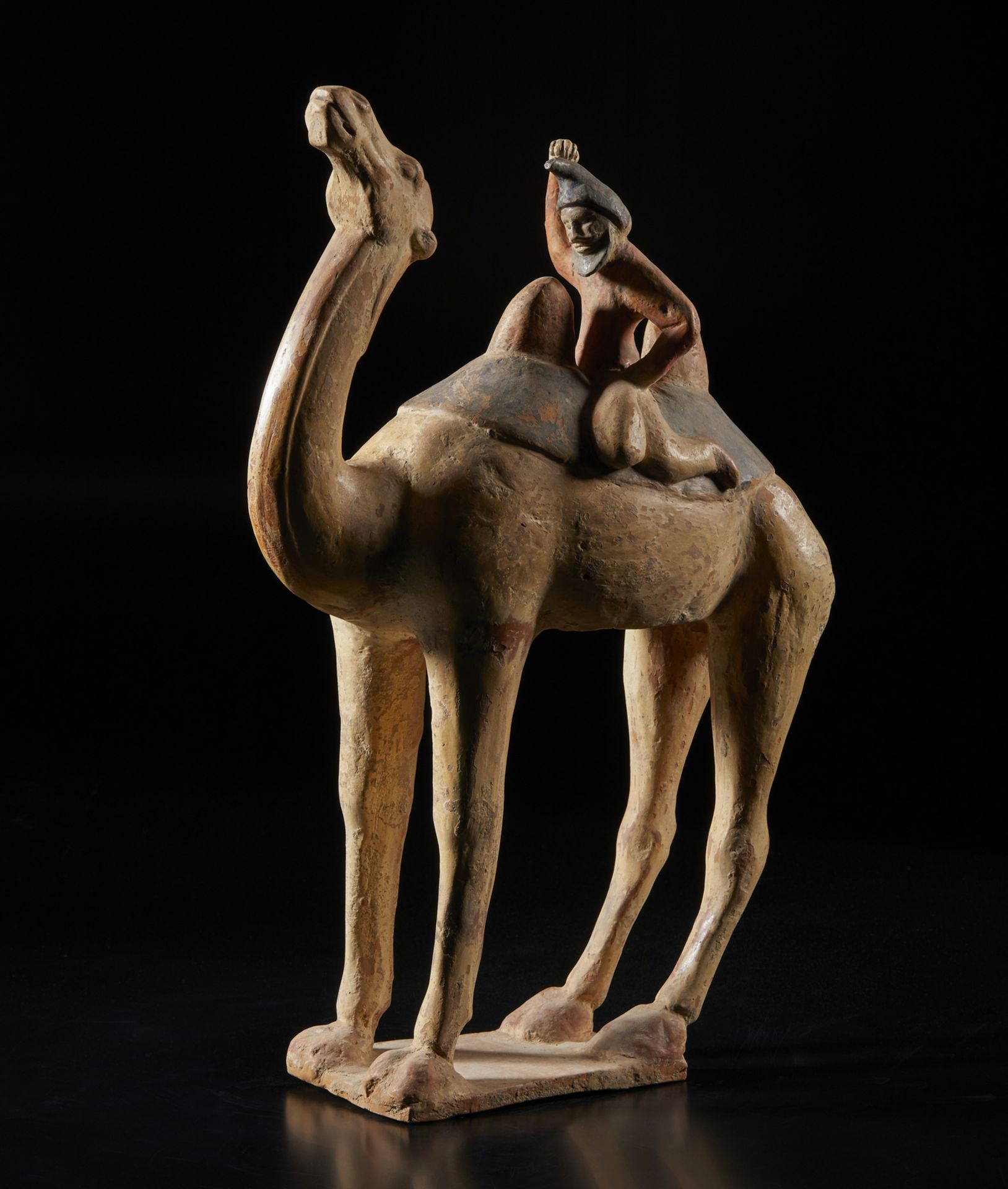 Arte Cinese A large polychrome model of a camel and its rider on horsebakChina, possibly Northern W