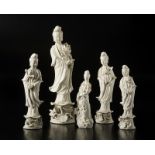 Arte Cinese Five Dehua porcelain sculptures depicting Guanyjn holding a blooming lotus branchChina,