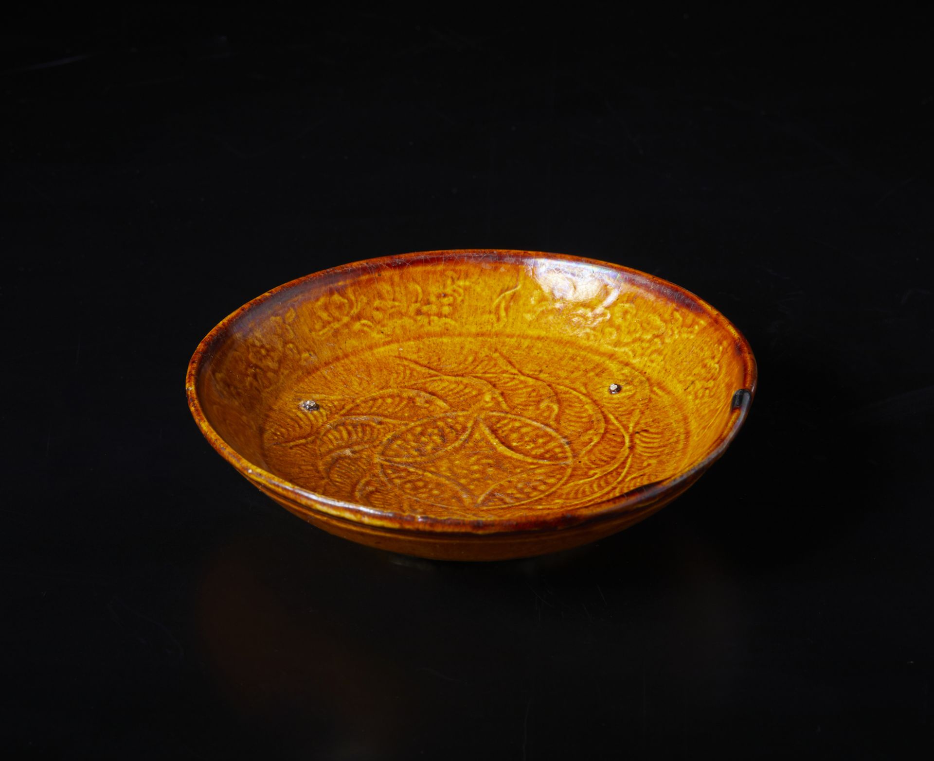 Arte Cinese A moulded decorated pottery bowlChina, Liao dynasty, 10th century.