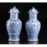 Arte Cinese Two large blue and white porcelain balauster vases and covers, decorated with dragons a