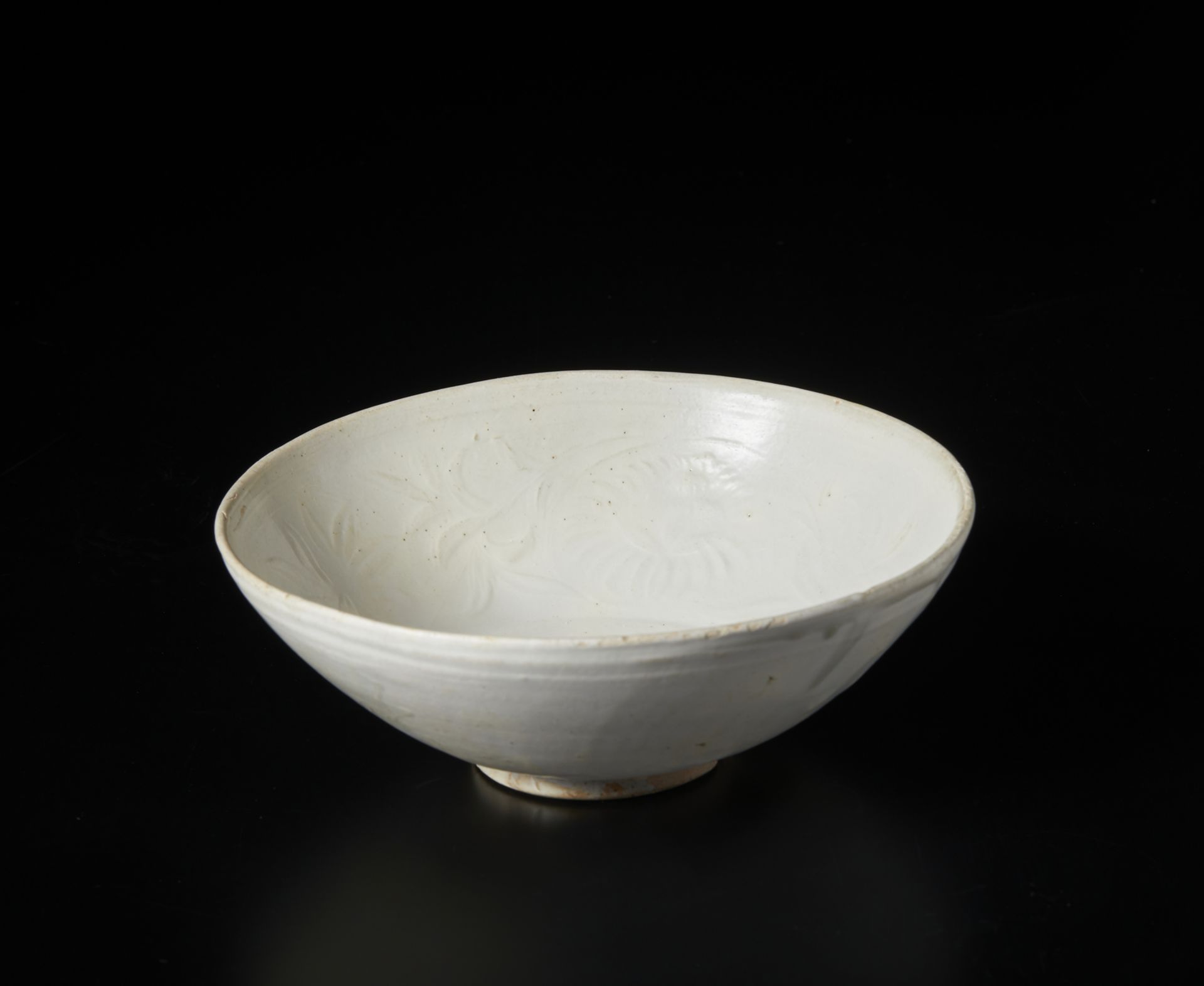 Arte Cinese  A fine Qingbai conical bowl with lotus scroll moulded decorationChina, Song, 13th centu