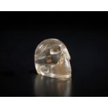 . A small rock Crystal vanitas carved as a human skull.
