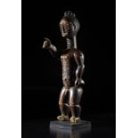 Arte africana Ivory Coast, Attie. Puppet? with movable arms.Wood with dark patina and metal pivots.