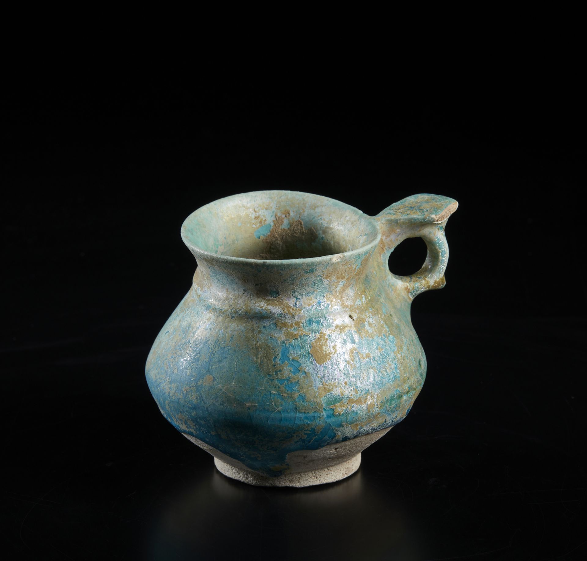 Arte Islamica  A fritware turquoise glazed jug Iran, 12th-13th century .