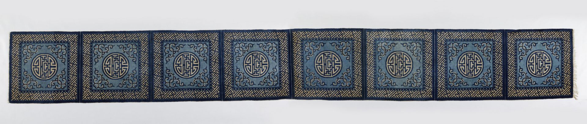 Arte Cinese A fine eight-seat Baotou blue ground rugChinese inner Mongolia, early 20th century .