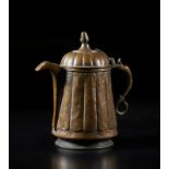 Arte Islamica A large ribbed body copper teapot chiselled with floral motifsKashmir, 19th century .