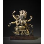 Arte Himalayana A gilt bronze figure of a wrathful deityTibet, Qing, 19th century.