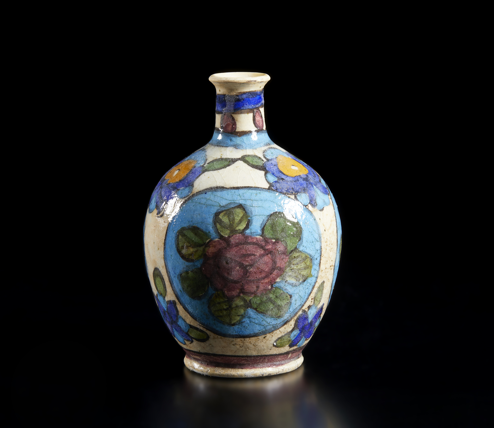 Arte Islamica A pottery bottle vase painted with flowers Iran, 19th-20th century .