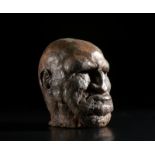 . A large grotesque head of an old man.