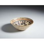 A terracotta slip painted calligraphic bowl Samanid Eastern Persia, 10th century Restored. Cm 22,