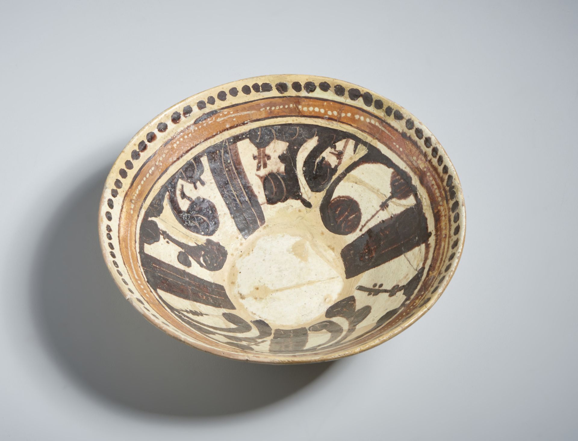 A terracotta slip painted calligraphic bowl Samanid Eastern Persia, 10th century Restored. Cm 22, - Image 2 of 3