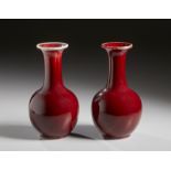 A pair of sang de boeuf porcelain vases bearing a four charcter zhuanshu mark at the base China,