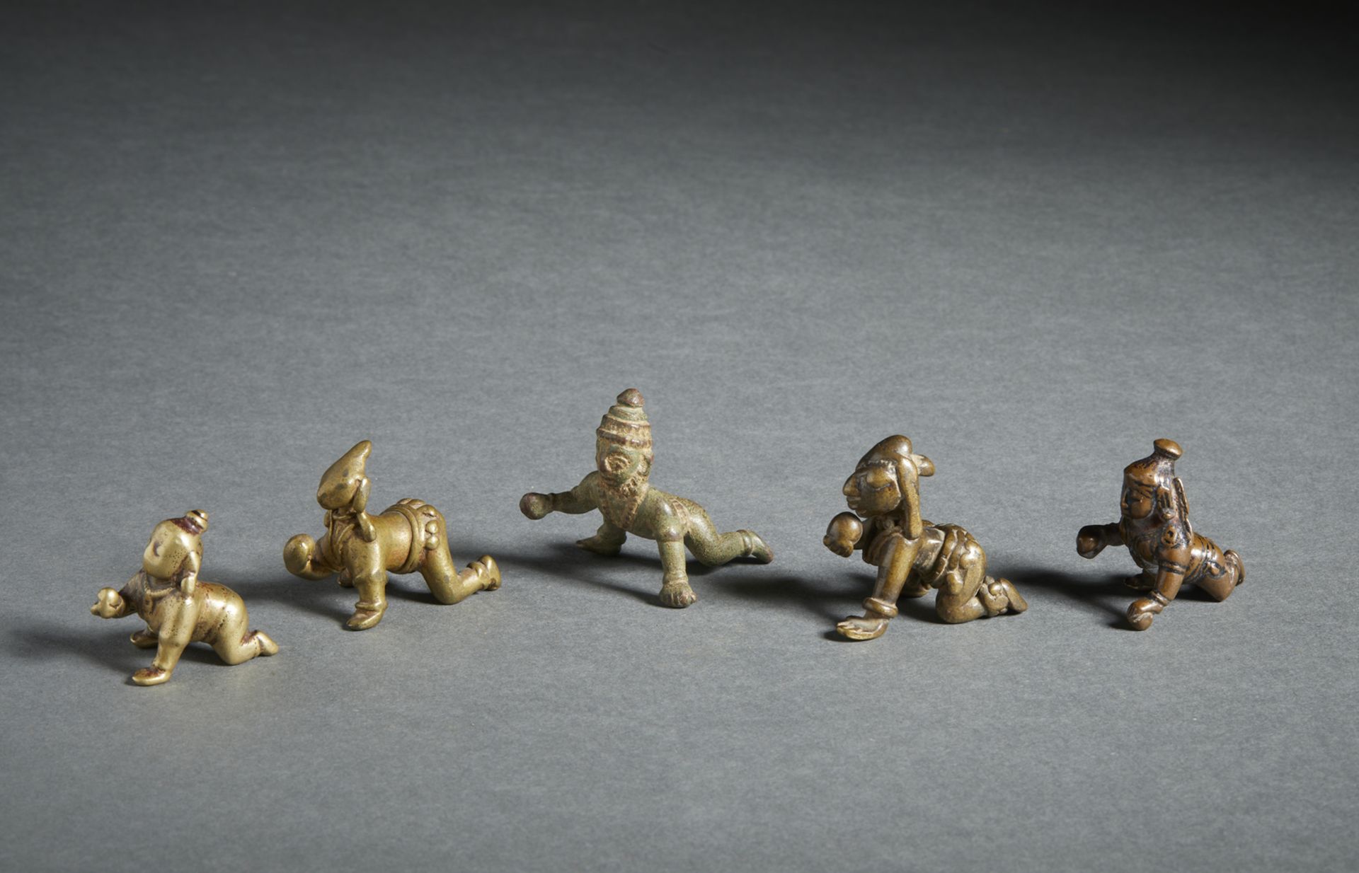 A group of five crawling copper alloy Balakrishna figures India, 18th-19th century The size shown - Image 2 of 2