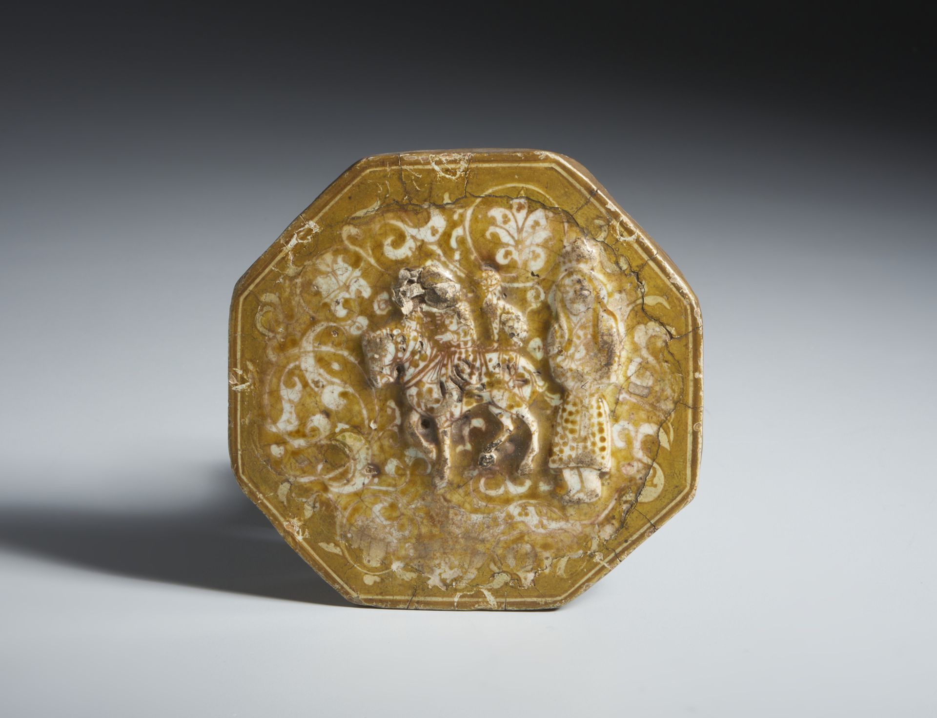 Octagonal tile with figurative decoration in relief Iran, 13th-14th century Frit body, moulded