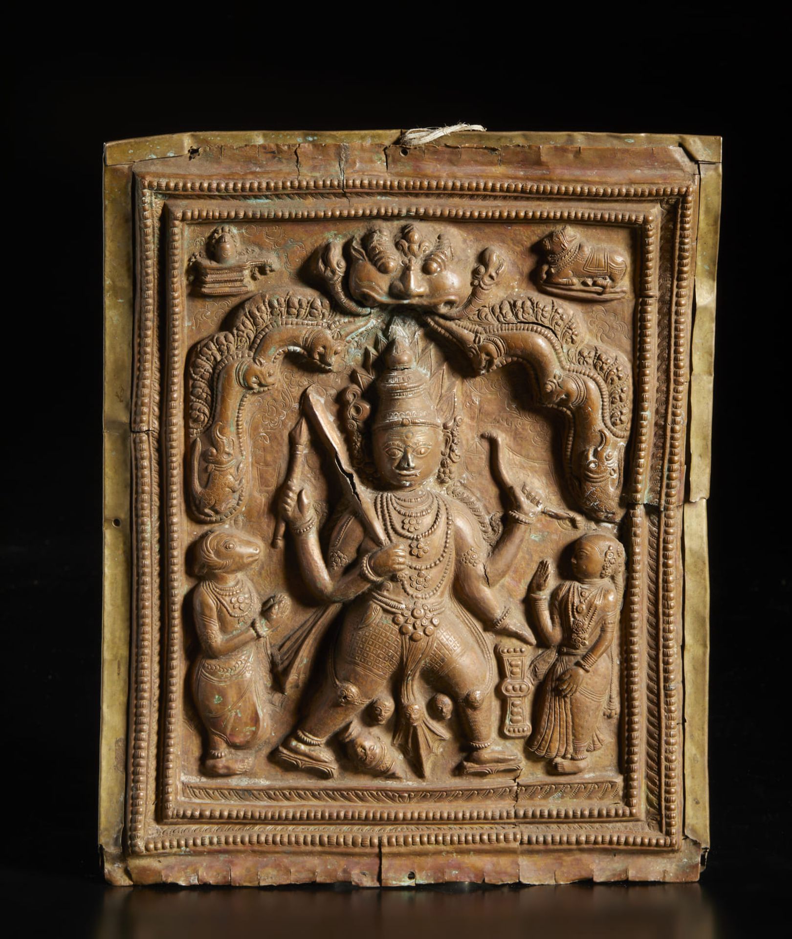 A copper embossed Virabhadra plaque Souther India, Tamil Nadu o Karnataka, 18th-19th century Cm 27,