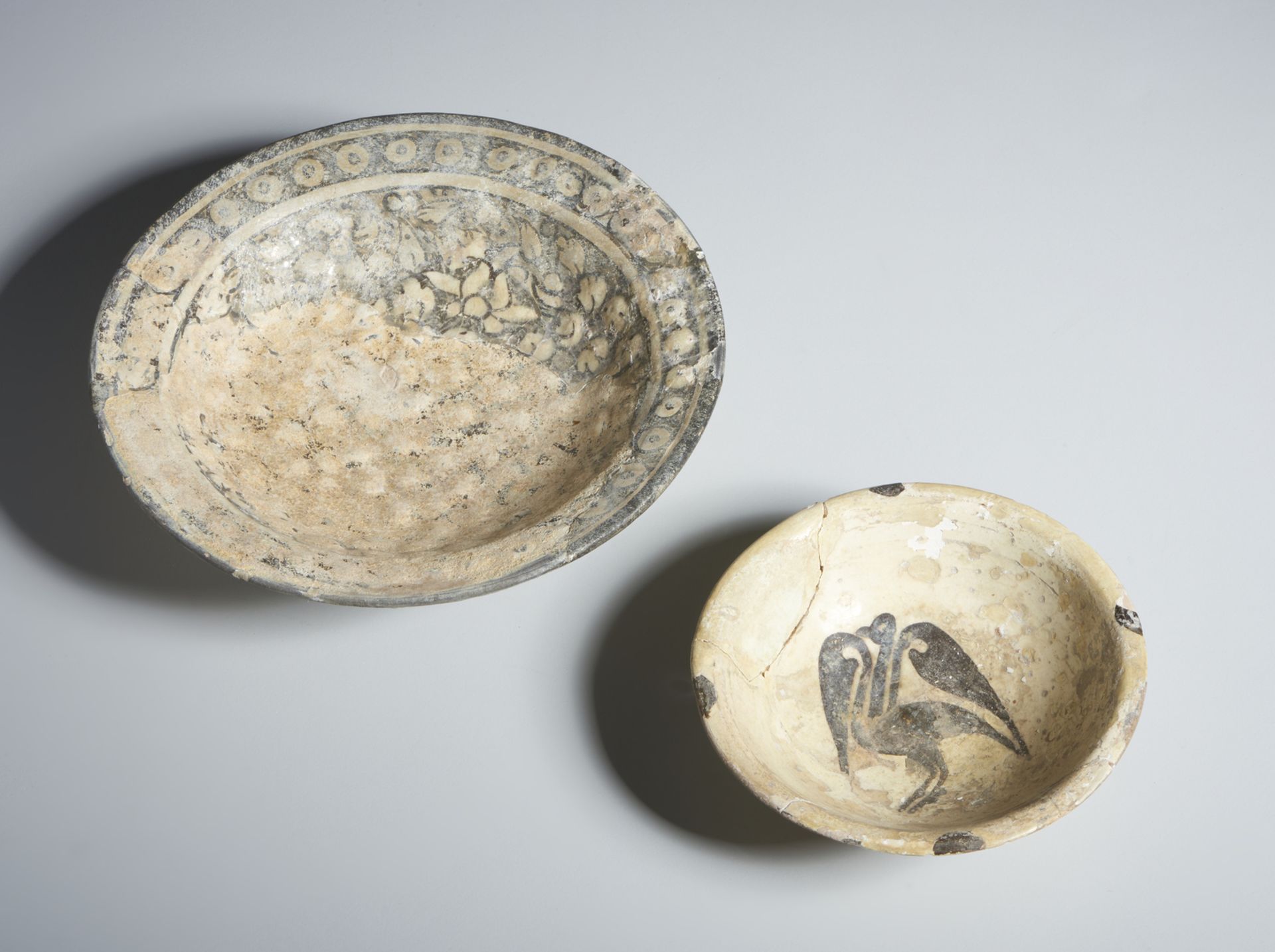 A slip painted ware and a Sultanabad dish Iran, 10th and 14th century One of terracotta body, slip - Image 2 of 3